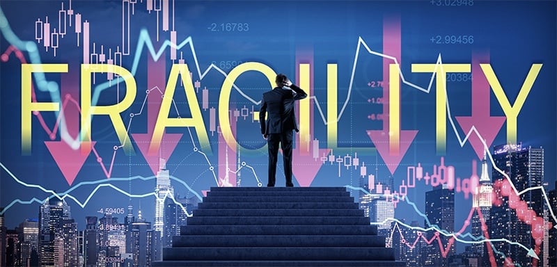 A lone figure faces a modern city skyline as volatile market charts and downward arrows surround the word “Fragility,” reflecting overconfident markets, record valuations, and the risk of a modern Great Depression driven by excess and instability.