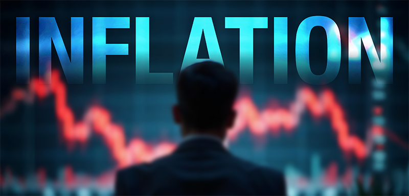 A silhouetted investor watches a plunging market chart beneath the bold word “Inflation,” capturing the renewed threat of Inflation 2.0. A stark visual warning that rising prices and market volatility could erode retirement savings—highlighting the urgency to protect wealth now.